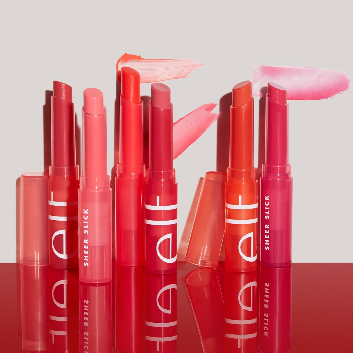 e.l.f. Sheer Slick Lipstick Orange Crush aangebracht op de lippen